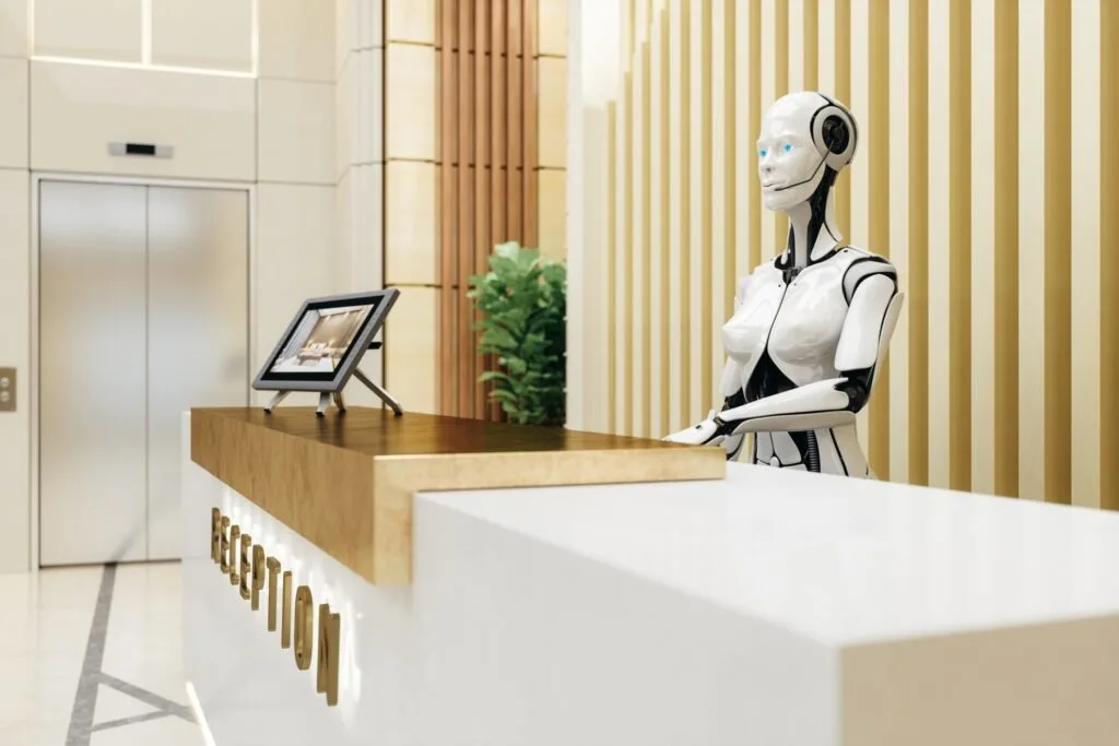 Hotel reception with digital interfaces representing AI-assisted hospitality operations